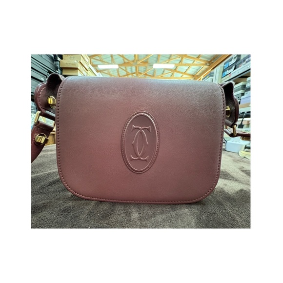 Cartier Handbags - Cartier Rare Wine Leather crossbody with Cartier engraved Mirror EUC